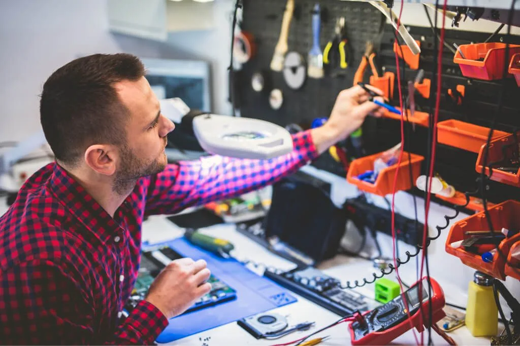 man repairing laptop